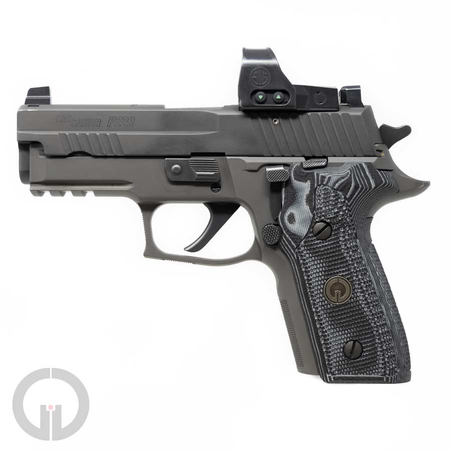 Custom Hogue P229 grips mounted on pistol